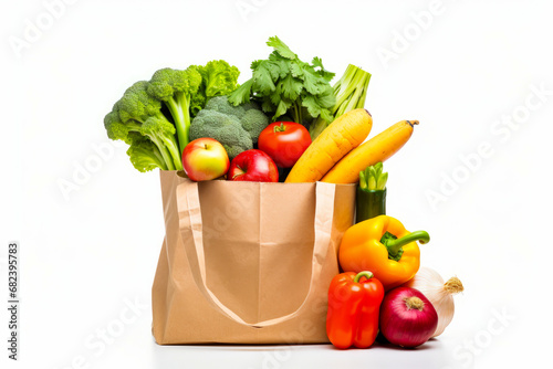 Bag full of vegetables and fruits on white background.