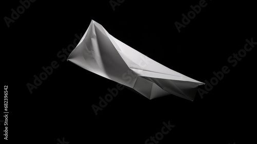 Big piece of paper flying in the air, solid black background