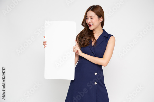 Asian woman showing and holding blank white billboard isolated on white background