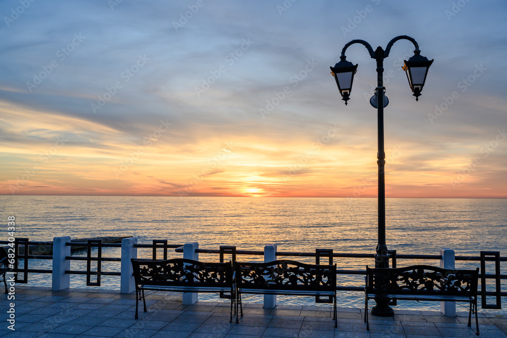Embankment with a lantern with a sunset view of the sea