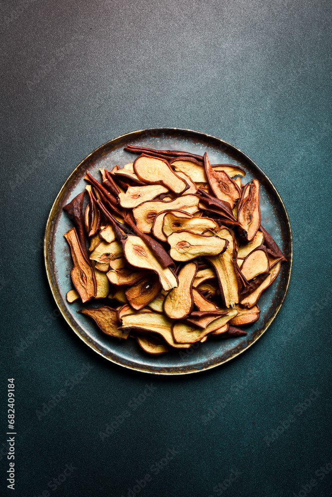 Homemade slices of dried pears.Dried pear or pear chips.Dried fruits Homemade slices of dried pears.Dried pear or pear chips.Dried fruits
