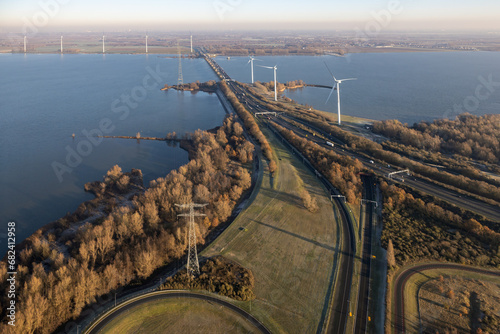Aerial view at Dutch Haringvliet Bridge with freeway in wintertime photo