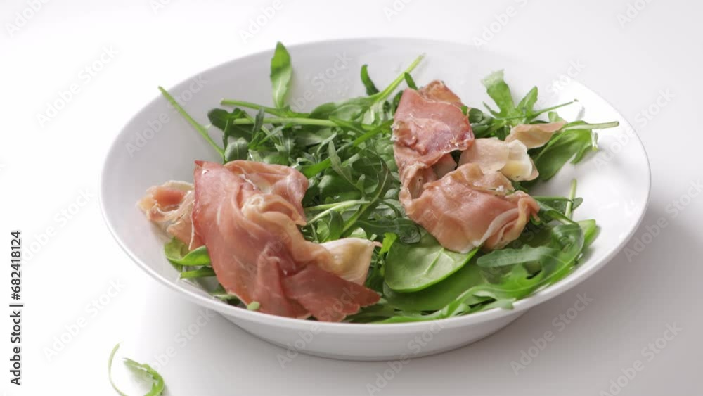 falling meat slice in platewith greens cooking food falling meat slice in platewith greens cooking food