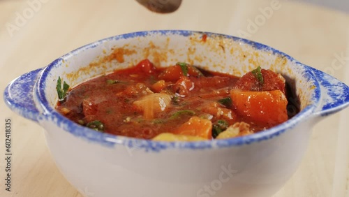 Hungarian Goulash soup with potato, carrot, meat and bolgarian papper and parsley cilantro in top. Shurpa soup photo