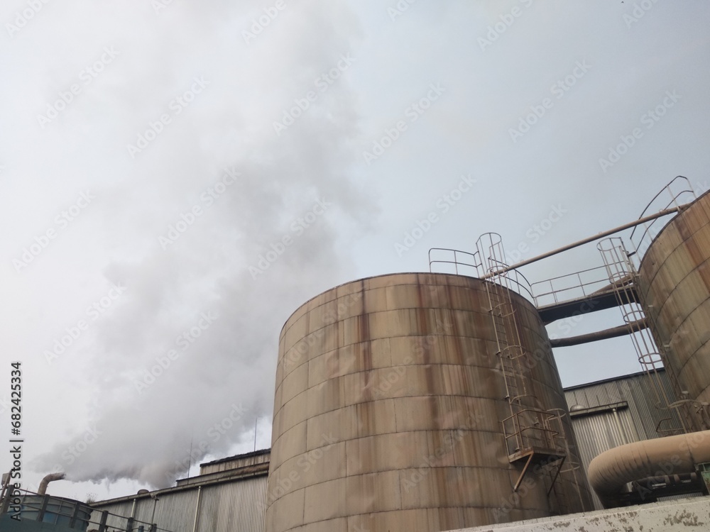 low angle view of huge storage tank for high temperature liquid