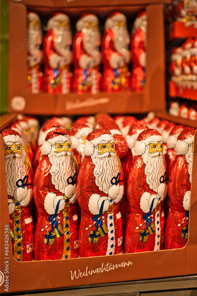 a lot of chocolate Santa Claus in a shop waiting to be bought for Christmas