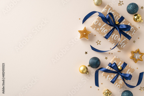 Delve into the gifts under the Christmas tree. Top view image showcasing artisanal gift boxes, elegant baubles, star-shaped candles, jingle bells, and glitzy confetti on a muted beige surface photo