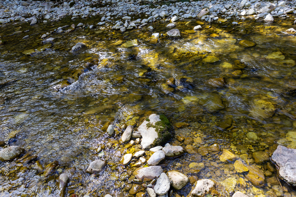 mountainous terrain, shallow river, sunny day, autumn walks in the bosom of nature, panorama of the area. mountainous terrain, shallow river, sunny day, autumn walks in the bosom of nature, panorama of the area.