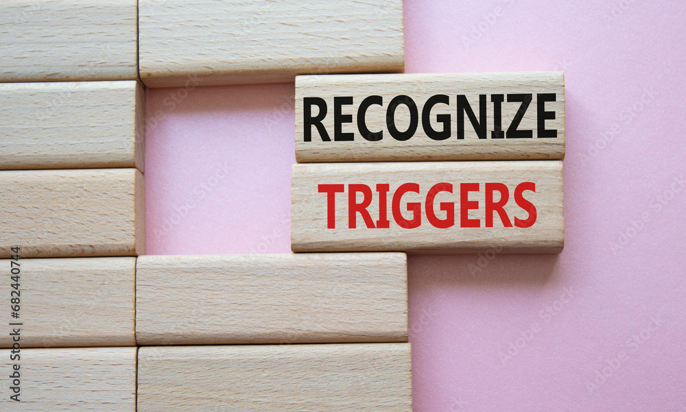 Recognize triggers symbol. Concept words Recognize triggers on wooden blocks. Beautiful pink background. Business and Recognize triggers concept. Copy space. Recognize triggers symbol. Concept words Recognize triggers on wooden blocks. Beautiful pink background. Business and Recognize triggers concept. Copy space.