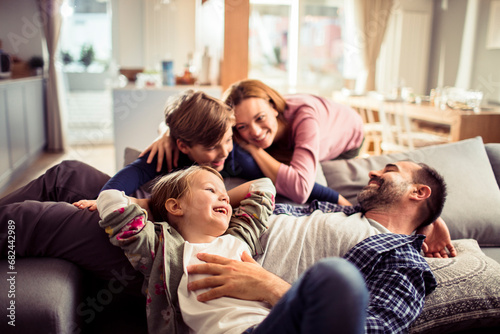 Joyful Parents Having Playtime with Children at Home