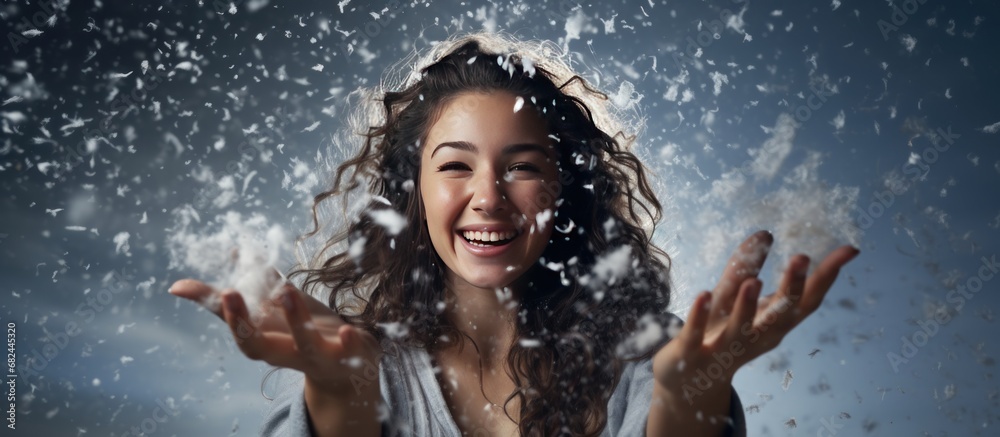 Obraz premium Portrait a beautiful young woman in winter blur snowflakes background. AI generated