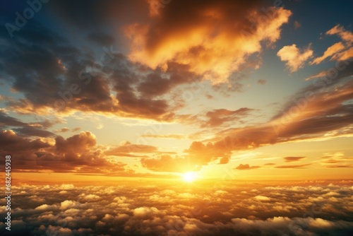 A beautiful sunset as the sun sets over a sea of clouds. Perfect for travel and nature-themed projects