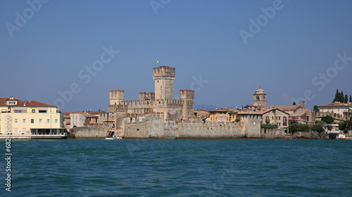 Fototapeta Naklejka Na Ścianę i Meble -  view of the castle of sirmione from lake garda with blue sky 