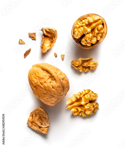 one whole and one open walnut isolated on white background vertical
