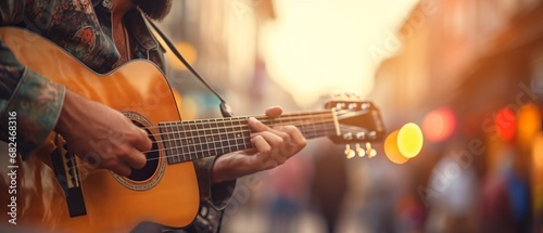 Close-Up of Street Musician Playing Guitar with Beautiful Blurred Background