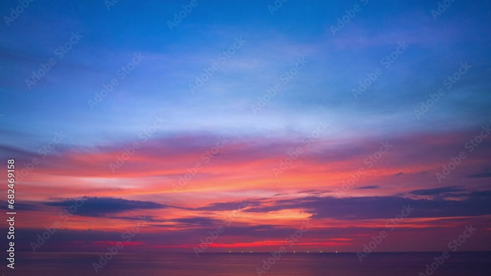 .Aerial hyperlapse day to night clouds are moving slowly in the colorful sky during sunset..amazing pink cloud in purple sky in beautiful sunset at the sea..colorful sky sunset or sunrise background. .Aerial hyperlapse day to night clouds are moving slowly in the colorful sky during sunset..amazing pink cloud in purple sky in beautiful sunset at the sea..colorful sky sunset or sunrise background.