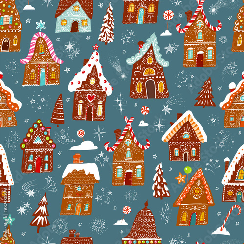 festive pattern with decorated christmas gingerbread houses on dark winter background