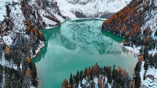 Aerial drone view of Lake Briers Pragser Wildsee Dolomites South Tyrol Italy. Autumn mountain landscape. High quality 4k footage photo