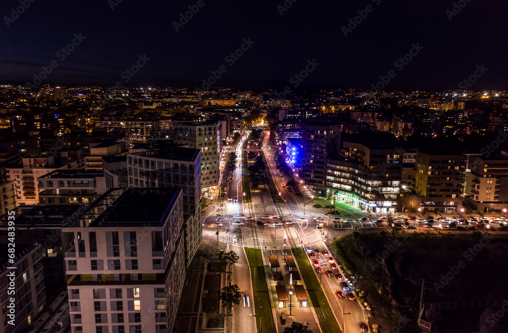 Montpellier's veins of light, night's embrace from above.