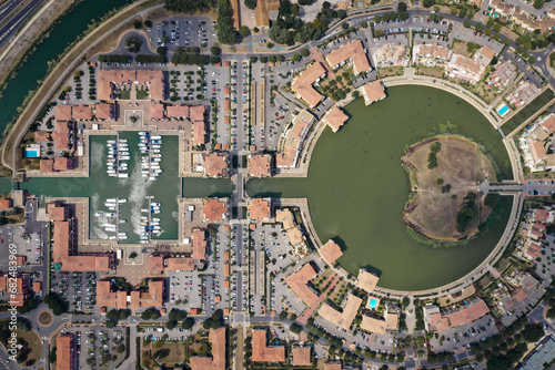 Aerial view of Port Ariane in Lattes, a circular marina hub.