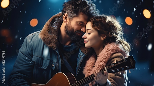 young happy couple with guitar at christmas time