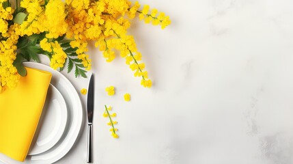Festive table setting for the spring celebration of women's day, birthday or mother's day with yellow mimosa flowers on a light background. The concept of the restaurant menu. Top view and copy space.