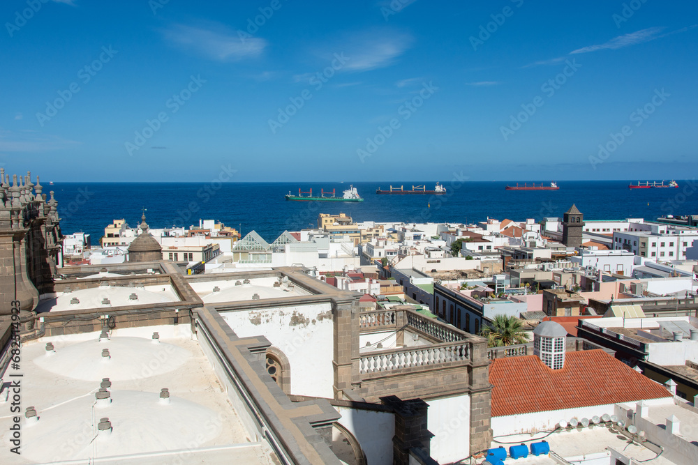 Town with part of the Santa Ana Cathedral, sea and freighter in Las Palmas on Gran Canaria, Spain
