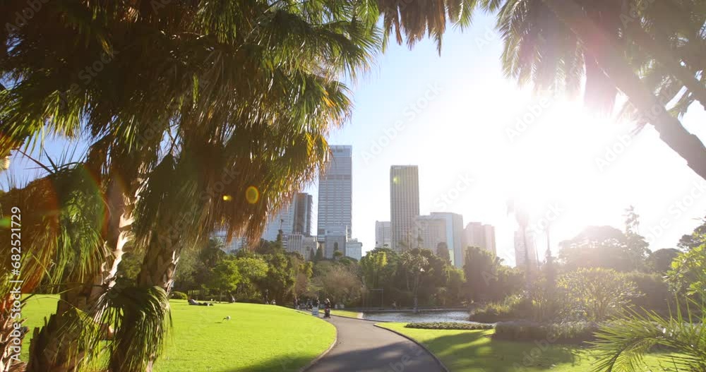 Tilt, steady cam shot forward through Sydney park