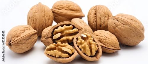 The elegant walnut, isolated in a white background, is not just a beautiful fruit but also a nutritious snack loaded with protein, energy, and healthy oils, making it an essential ingredient for a photo