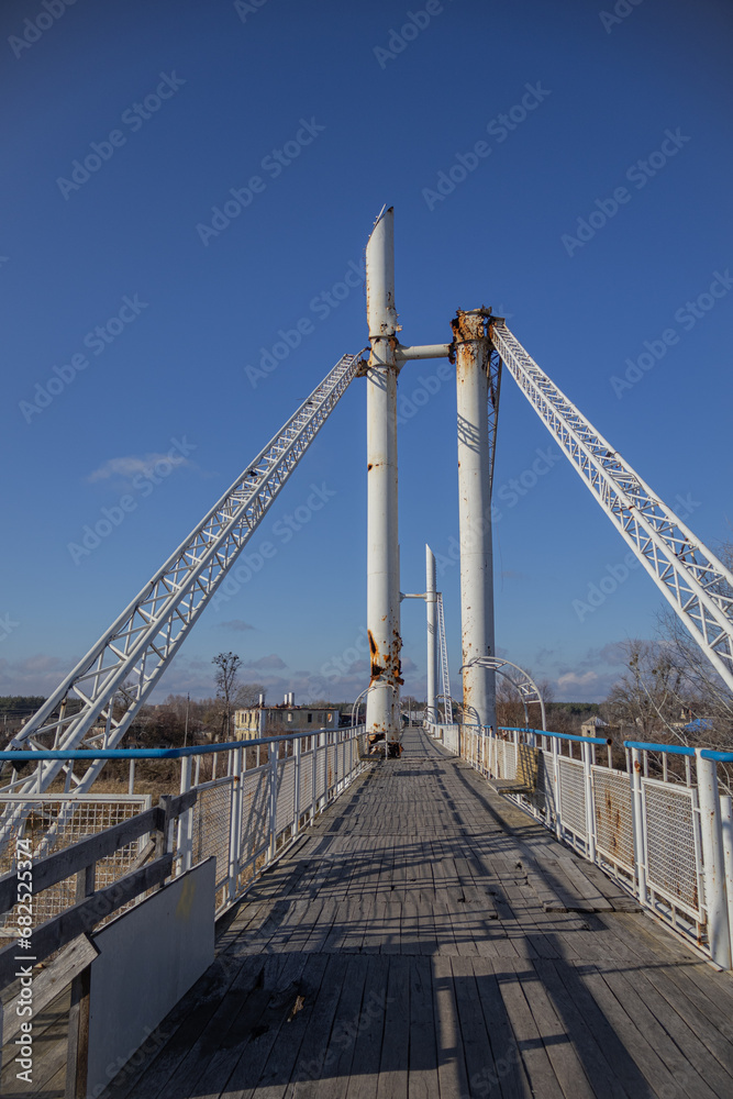 Izyum, Ukraine - November 10, 2023. pedestrian bridge that was fired upon many times, but survived