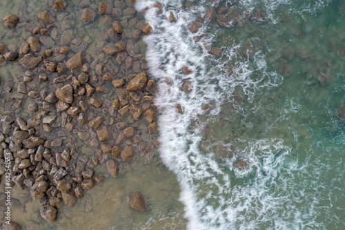 Wallpaper Mural Waves breaking over Boulders in the Sand White Water on Rock Formation Torontodigital.ca