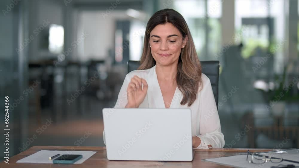 Happy mature business woman entrepreneur in office using laptop at work, smiling professional middle aged 40 years old female company executive wearing suit working on computer at workplace.