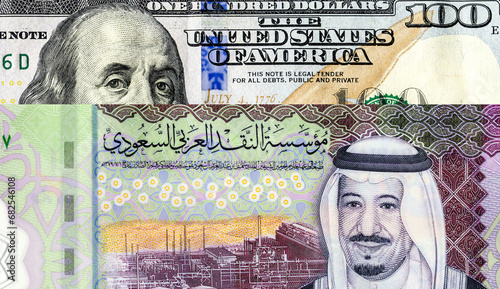 Saudi Arabia banknote with King Salman and American dollars banknote with Benjamin Franklin. Business concept of the exchange rate, stock exchange photo