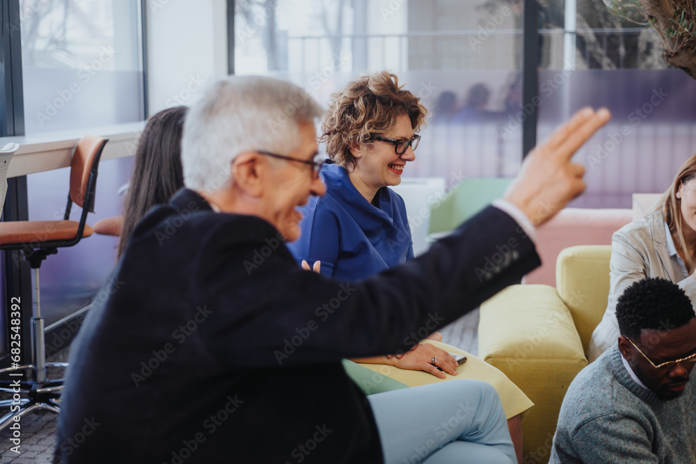 Business team in a modern office collaborates for growth, sharing innovative ideas and strategies. Effective teamwork, time management, and a positive environment foster productivity and success.