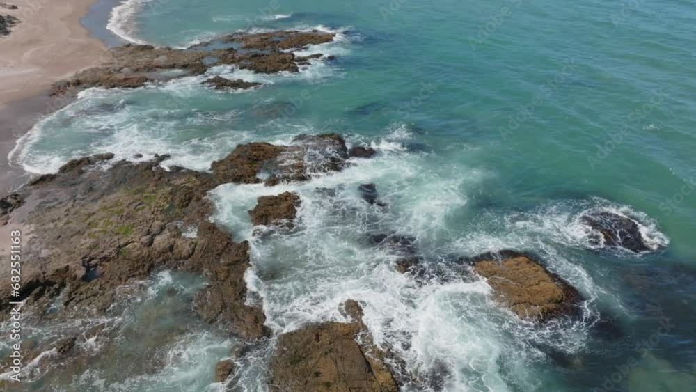 Aerial: Sandy beach and rocky coastline in the Bay of Islands, Elliot Bay, New Zealand Aerial: Sandy beach and rocky coastline in the Bay of Islands, Elliot Bay, New Zealand