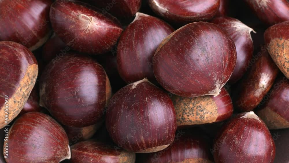 Ripe chestnuts close up. Sweet raw chestnuts. Husked chestnuts. Organic food Ripe chestnuts close up. Sweet raw chestnuts. Husked chestnuts. Organic food