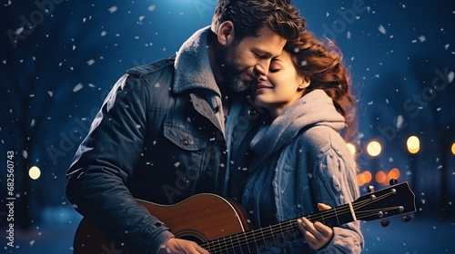 young happy couple with guitar at christmas time