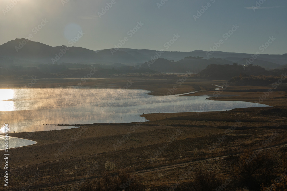 autumn, autumn views, autumn forests. views of a plain with a lake, mist is coming out of the lake, it is an autumn paradise. 