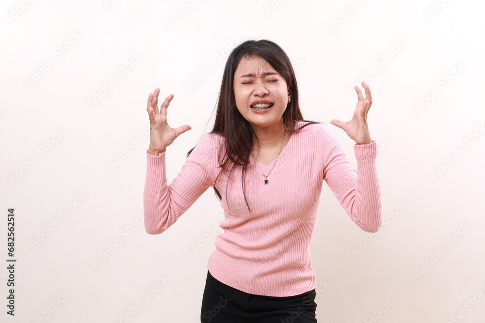 Stressed frustrated depressed young asian girl standing against white background Stressed frustrated depressed young asian girl standing against white background