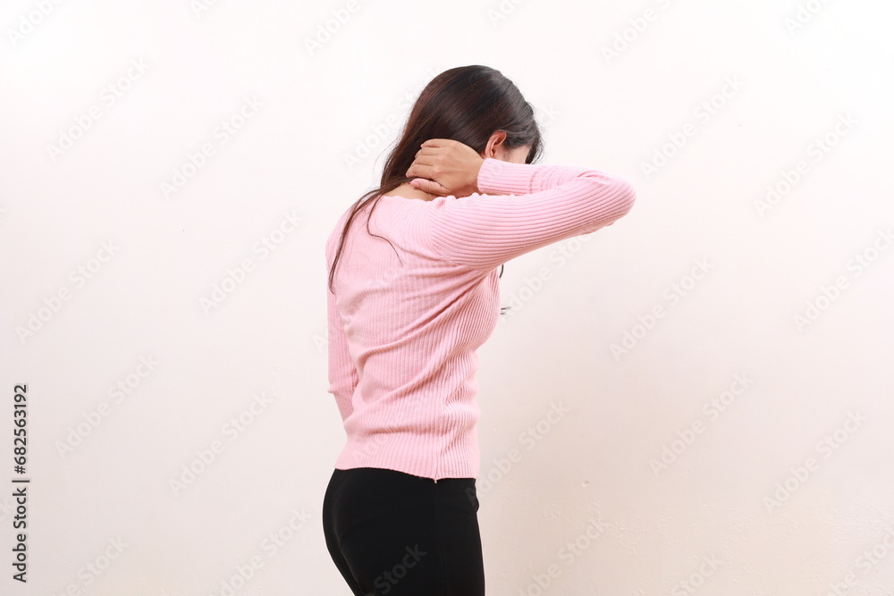Unhealthy woman touching neck feeling pain and numbness, worried about muscle tension. Isolated on white Unhealthy woman touching neck feeling pain and numbness, worried about muscle tension. Isolated on white