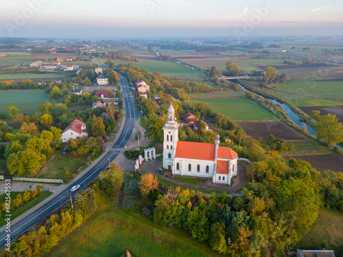 Aerial autumn view at church in Chelmno on the Ner River, a village in Poland photo