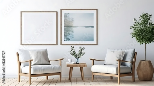 Two armchairs in room with white wall and big frame poster on it. Scandinavian style interior design of modern living room