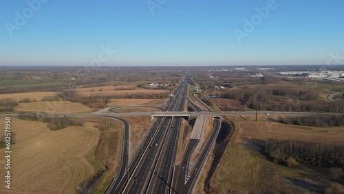 Highway overpass over interstate 75 near the city of Georgetown in Kentucky with a view to local auto assembly factory photo