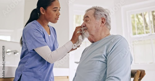 Sick, cleaning or caregiver helping an old man in nursing home, retirement clinic for wellness or support. Face towel, health or elderly patient with nurse or social worker for senior care service photo
