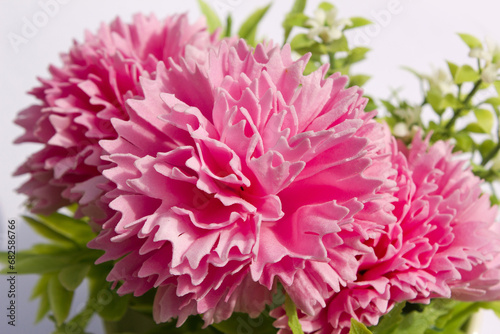 pink carnation flower made from soap on white background.