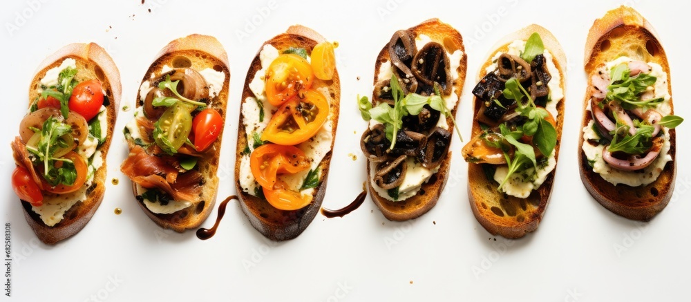 At the modern party, the guests savored the gourmet bruschetta topped with anchovy, cheese and vegetables, accompanied by olive oil, bread, and Mediterranean flavors, a new and delicious addition to