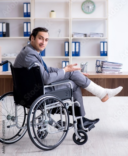 Male employee in wheel-chair in the office © Elnur