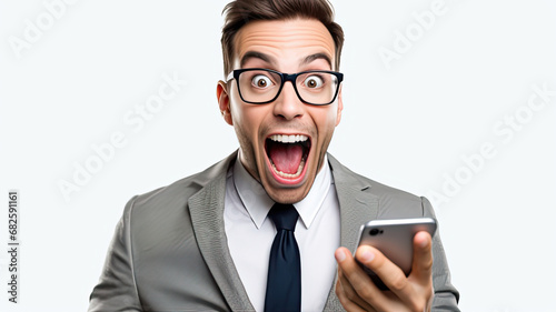 Man in suit holding smart phone devices in left hand, showing surprise and excitement. Over a white background. Using phone for texting, browsing social media, online shopping and internet.