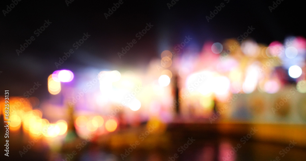 Colorful Bokeh abstract blurred background music festival stage show performance party. Vibrant bokeh background spark animate motion. Backdrop display with twinkling night life shape blinking light