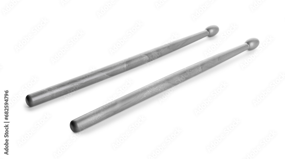 Two grey drum sticks isolated on white Two grey drum sticks isolated on white
